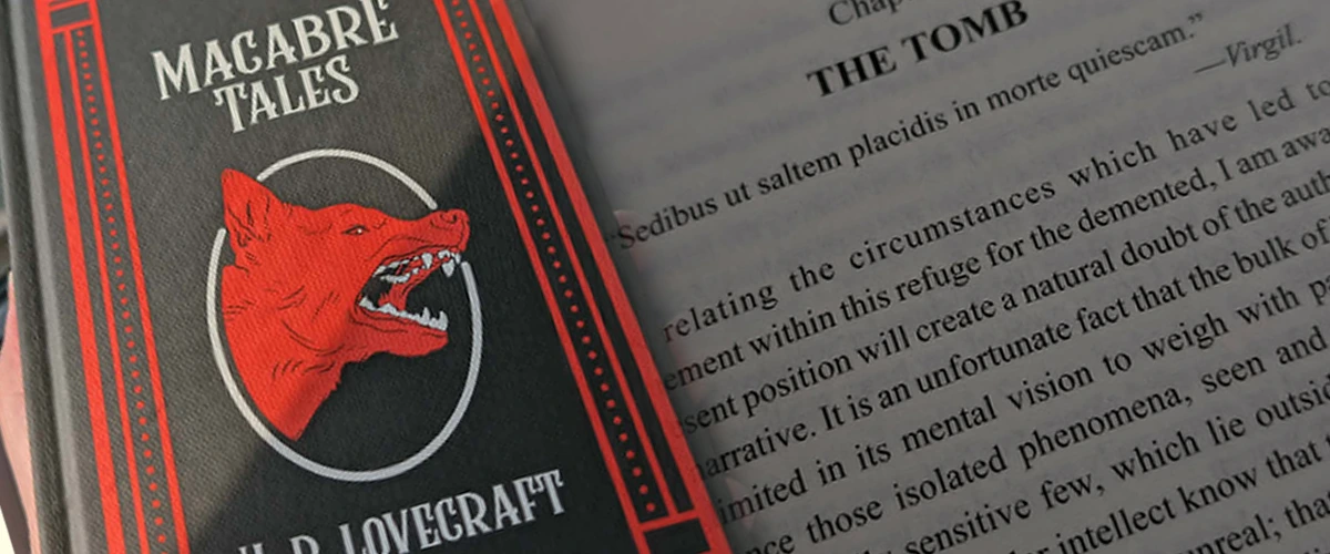Close-up of the book "Macabre Tales"  next to an open page of a short story called The Tomb by H.P. Lovecraft with Latin and English text.