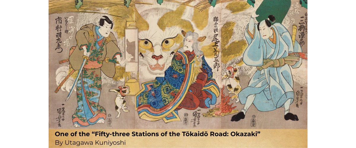 Japanese woodblock print showing three figures, 2 cats dancing around a fire, and a giant cat face; labeled “Fifty-three Stations of the Tōkaidō Road: Okazaki.” by Utagawa Kunioshi